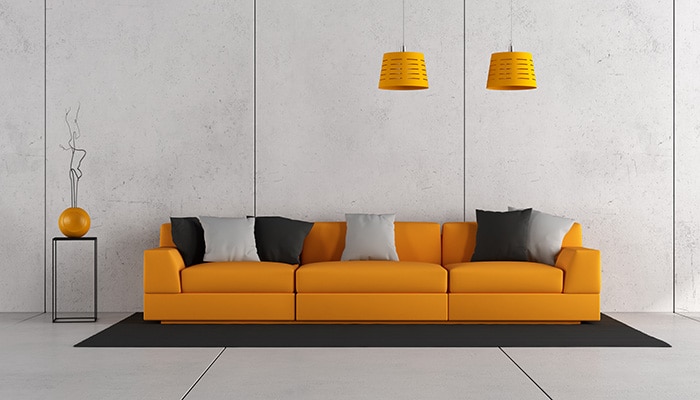 Modern living room with orange sofa and concrete wall - 3d rendering
